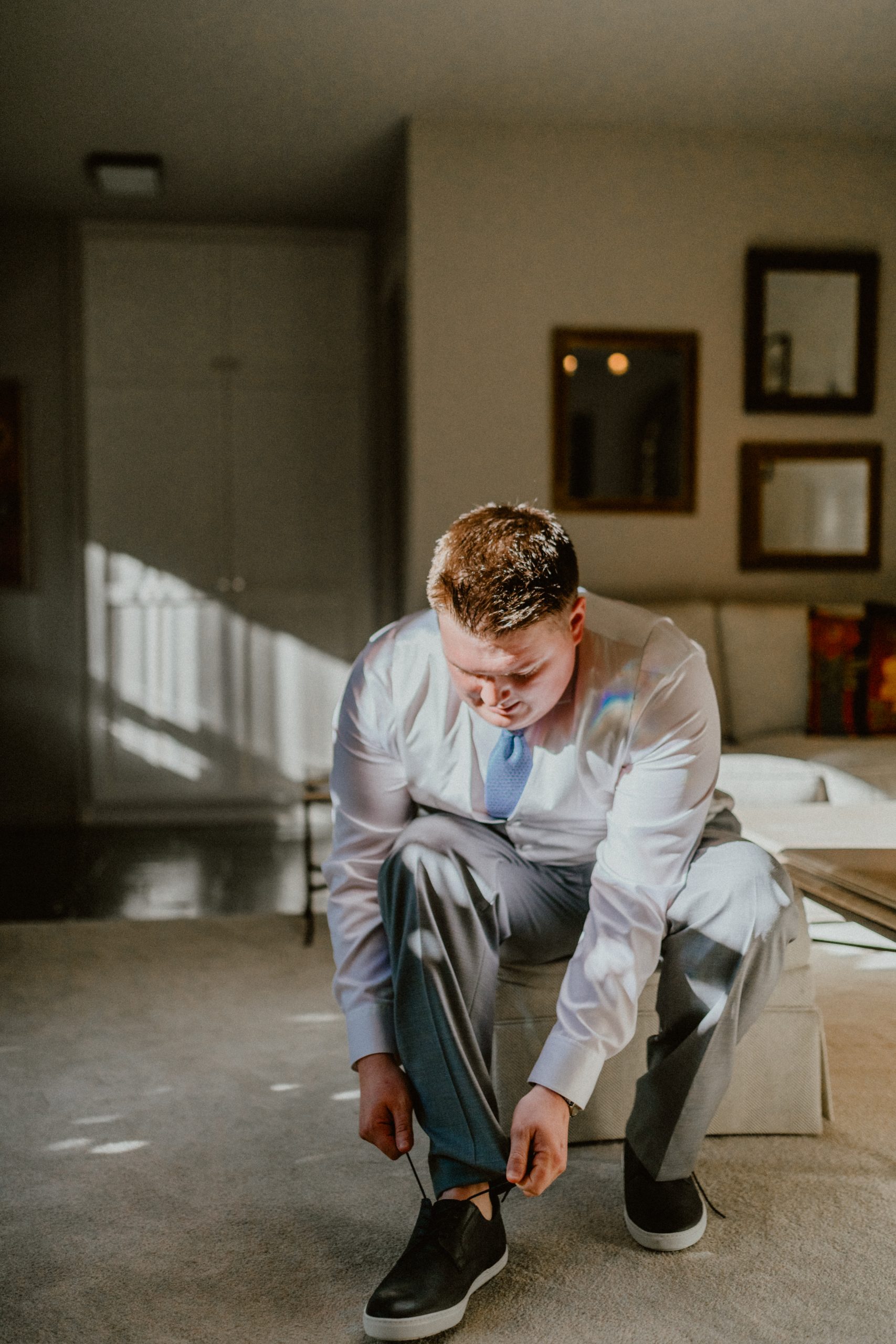 Groom Style, Groom ties up shoes before backyard wedding elopement | Seattle Wedding Photographer, Seattle Elopement Photographer | chelseaabril.com