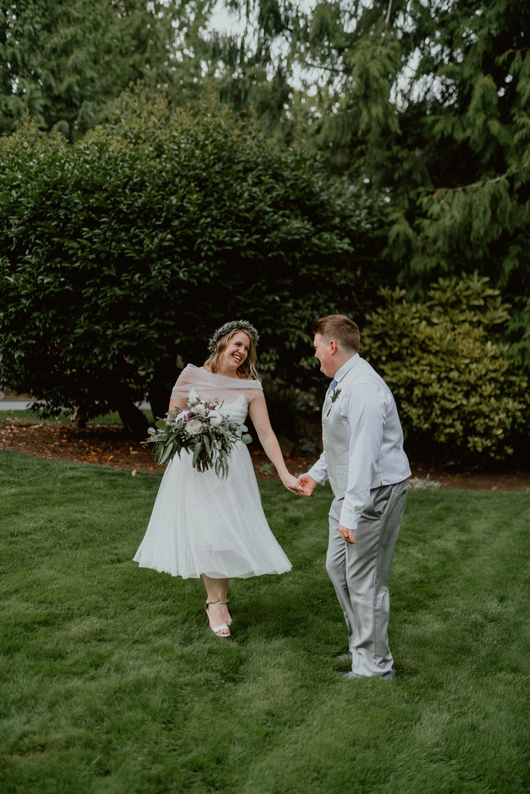 Bride and Groom pose and kiss with their rings after they say wedding vows in intimate backyard elopement | Seattle Wedding Photographer, Seattle Elopement Photographer | chelseaabril.com