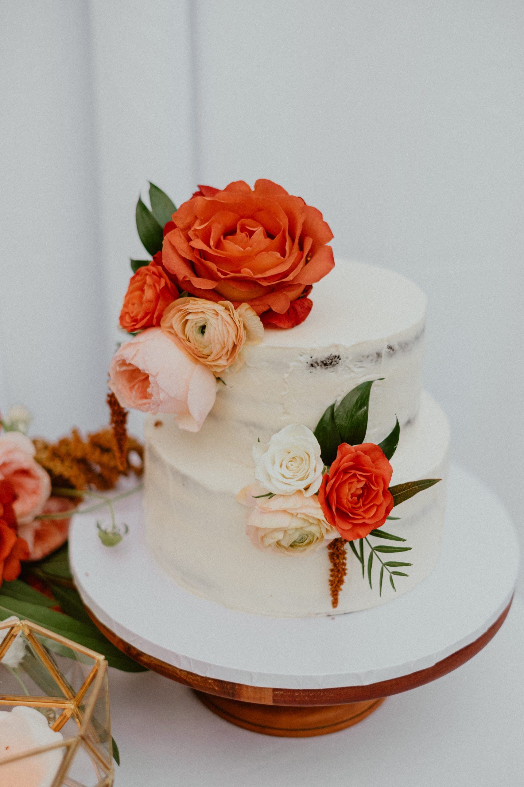 Wedding detail photography inspiration of Hawaiian fall wedding day inspiration with rustic cake with orange and peach florals | Big Island Elopement, Hawaii Elopement Photographer, Hawaii Elopement and Wedding Inspiration, Hawaii Elopement ideas, Big Island Wedding Inspiration, Fall Hawaiian Wedding Ideas, Fall Wedding Inspiration, Hawaii Outdoor Wedding Ideas | chelseaabril.com