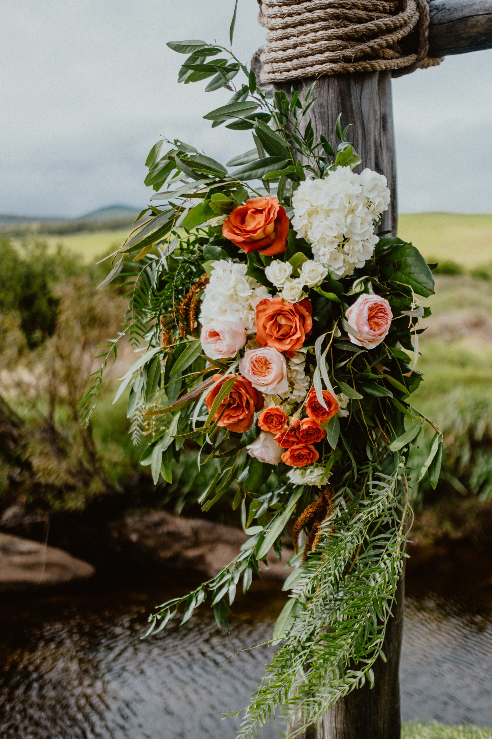 Fall floral wedding inspiration of floral arch for mini destination wedding on Big Island in Hawaii 