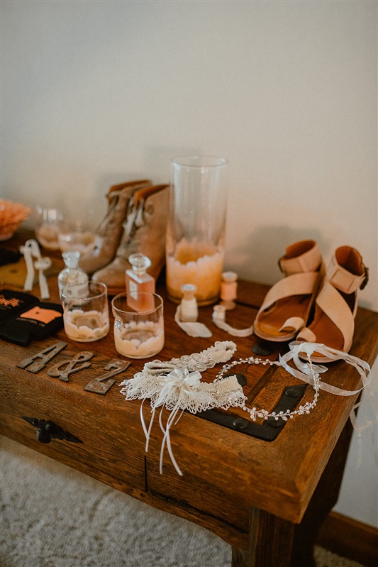 Pre-ceremony detail photography of bride's garter and shoes with accents | Sun River Elopement, Destination Elopement Photographer, Smith Rock Elopement Inspiration, Oregon Elopement ideas, PNW Fall Wedding Inspiration, Fall Outdoor Wedding Ideas,Fall Wedding Inspiration, PNW Outdoor Wedding Ideas | chelseaabril.com
