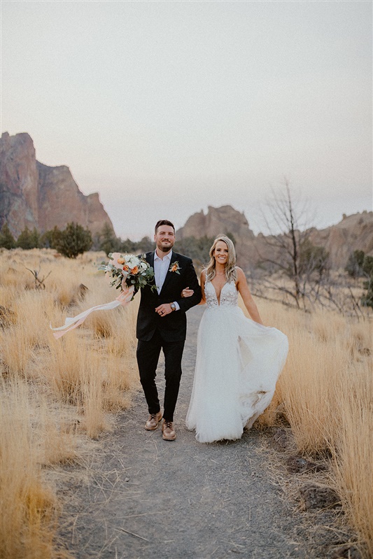 Bride and groom post-ceremony photography inspiration at Smith Rock state park in wedding attire bride style inspiration and groom style ideas | Sun River Elopement, Destination Elopement Photographer, Smith Rock Elopement Inspiration, Oregon Elopement ideas, PNW Fall Wedding Inspiration, Fall Outdoor Wedding Ideas,Fall Wedding Inspiration, PNW Outdoor Wedding Ideas | chelseaabril.com