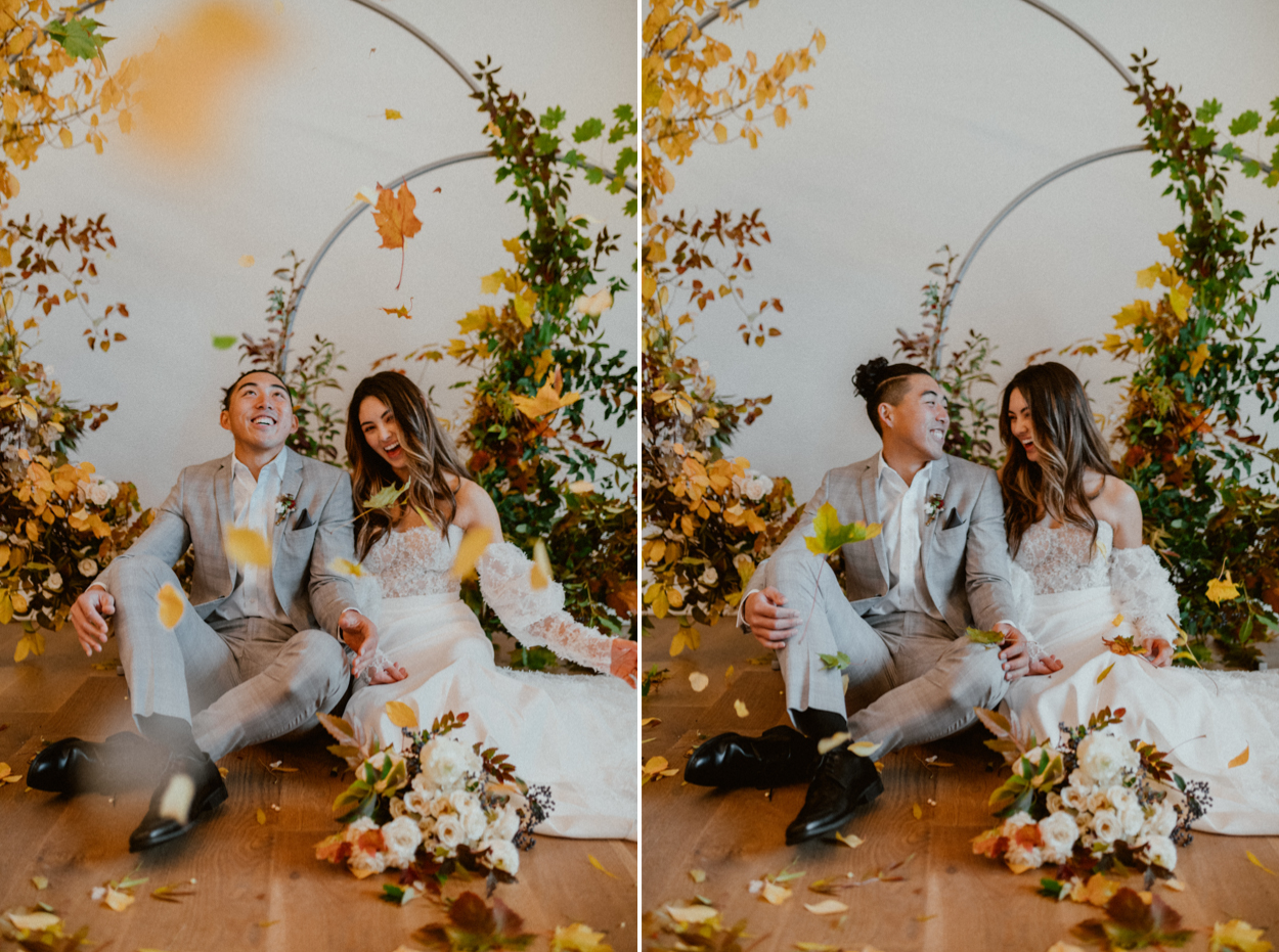 Bride and groom sitting in front of arbor background in block 41 seattle