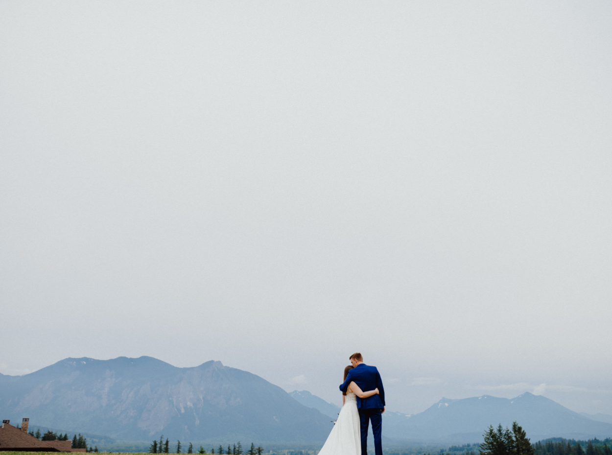 romantic bride and groom mountain background photo