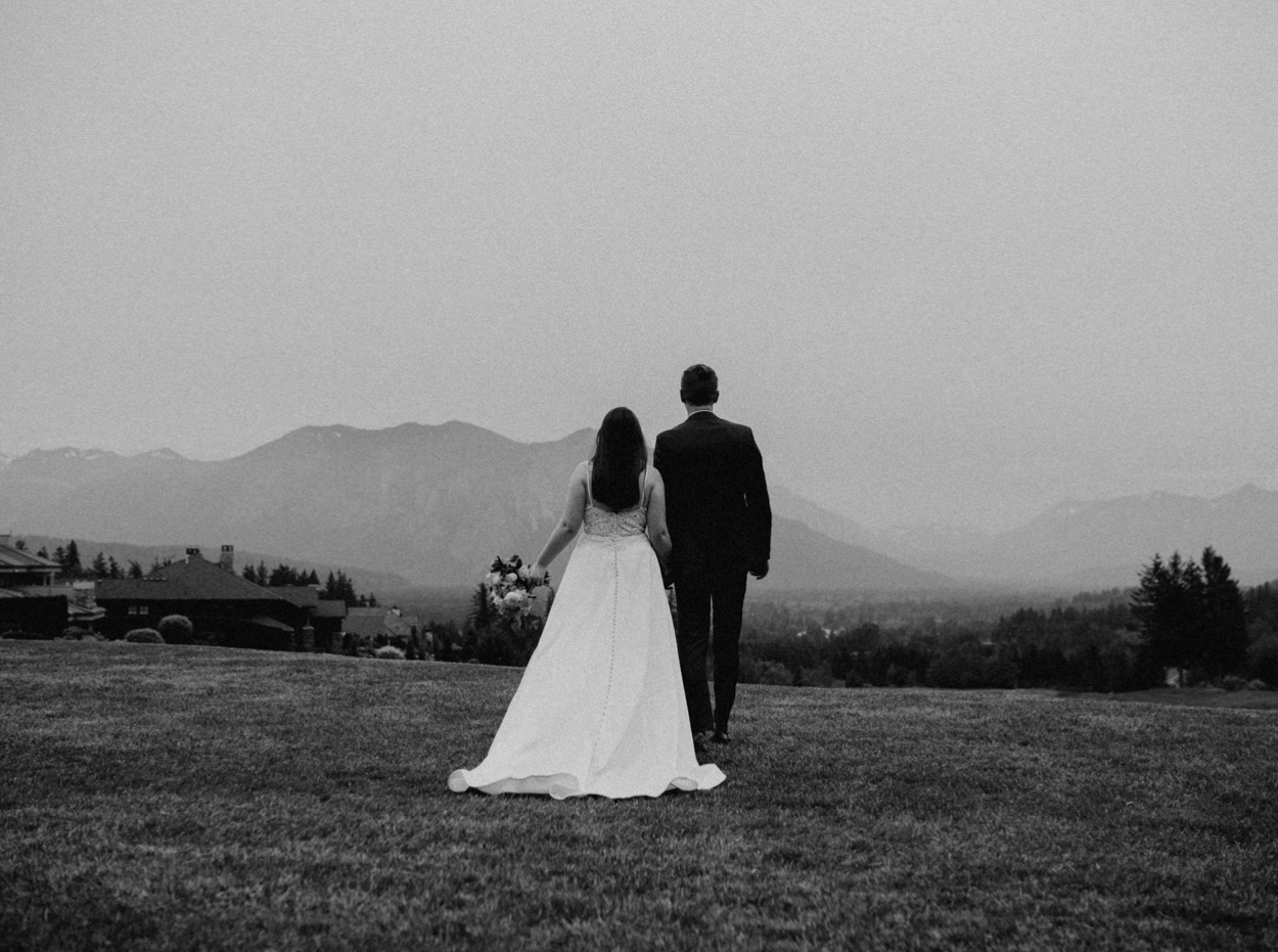 Bride and Groom black and white facing the mountains