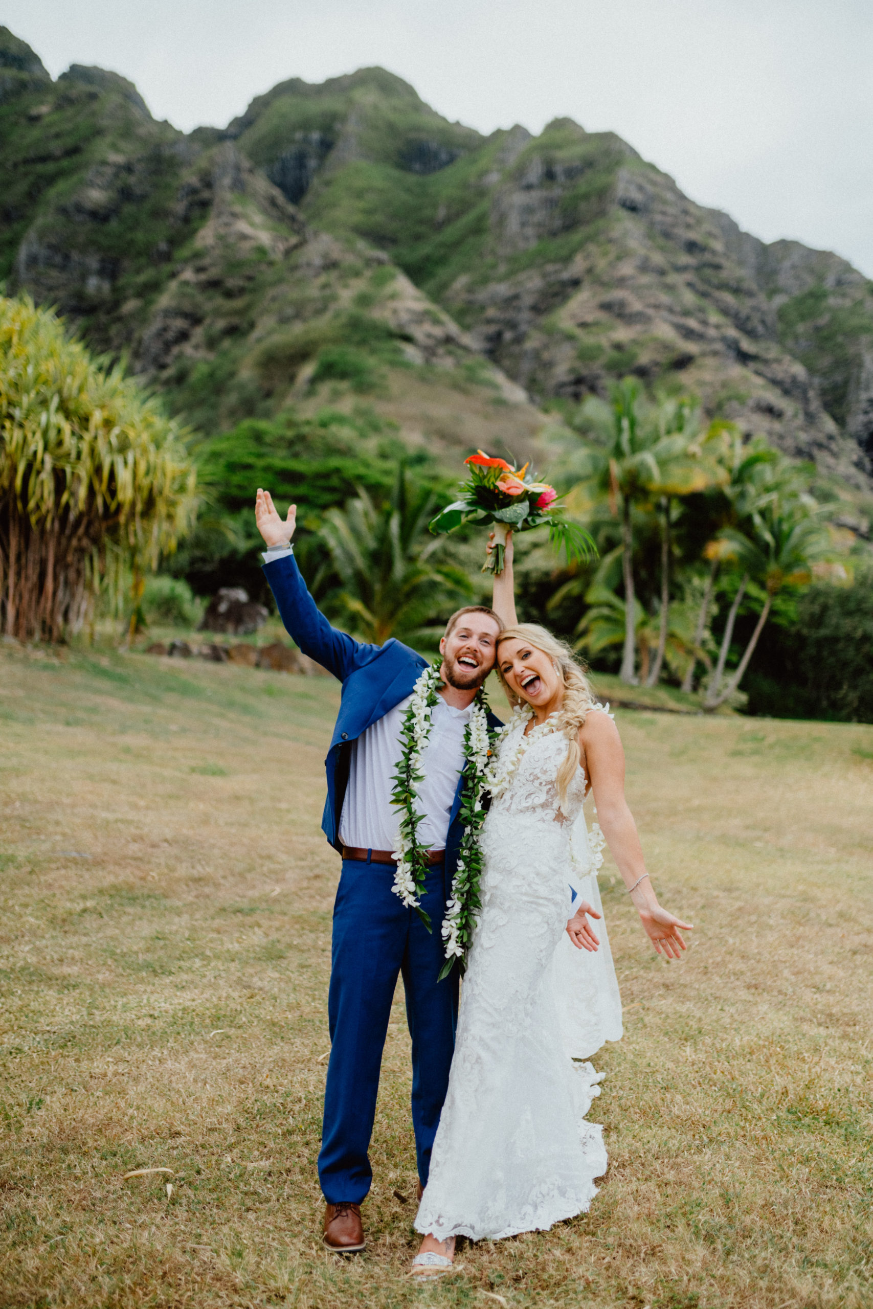 Bride Groom celebrating in Paliku Gardens Kualoa Ranch with Koʻolau Range backdrop Jurassic park theme