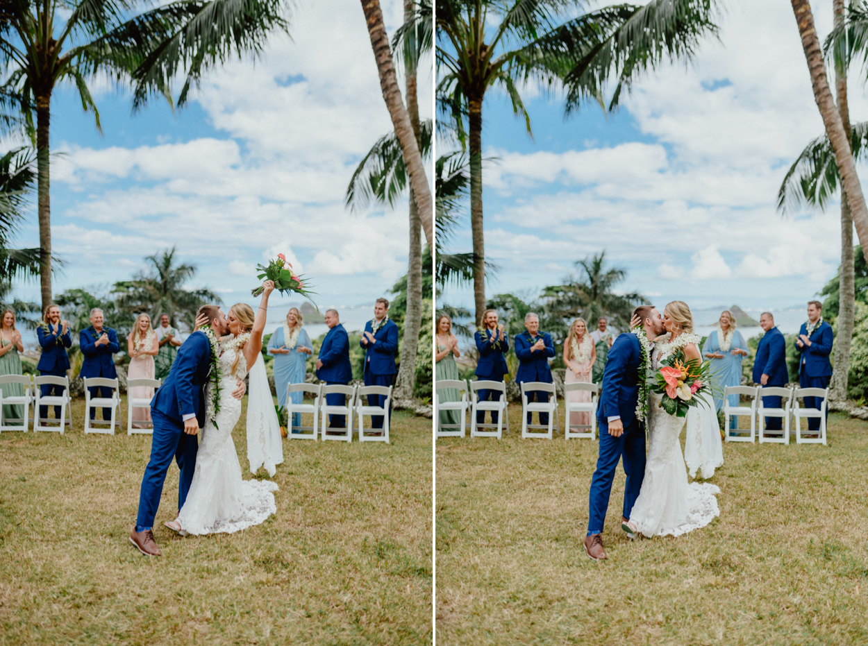 Bride and Groom celebrating in Paliku Gardens Venue at Kualoa Ranch wedding with Chinaman's hat background