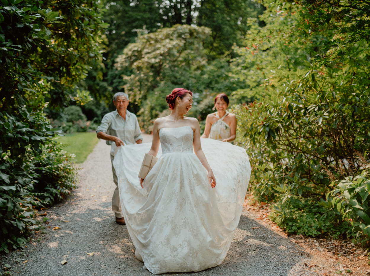 Dunn Gardens wedding, bride walking around the garden, parents holding her dress