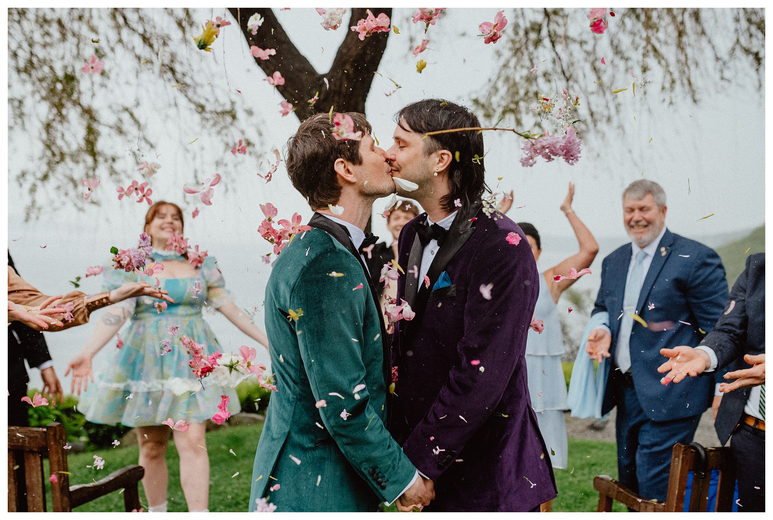 grooms kissing during ceremony 